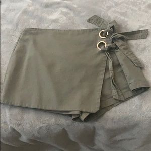 ALAYA GROMMET WRAP SKORT IN OLIVE GREEN